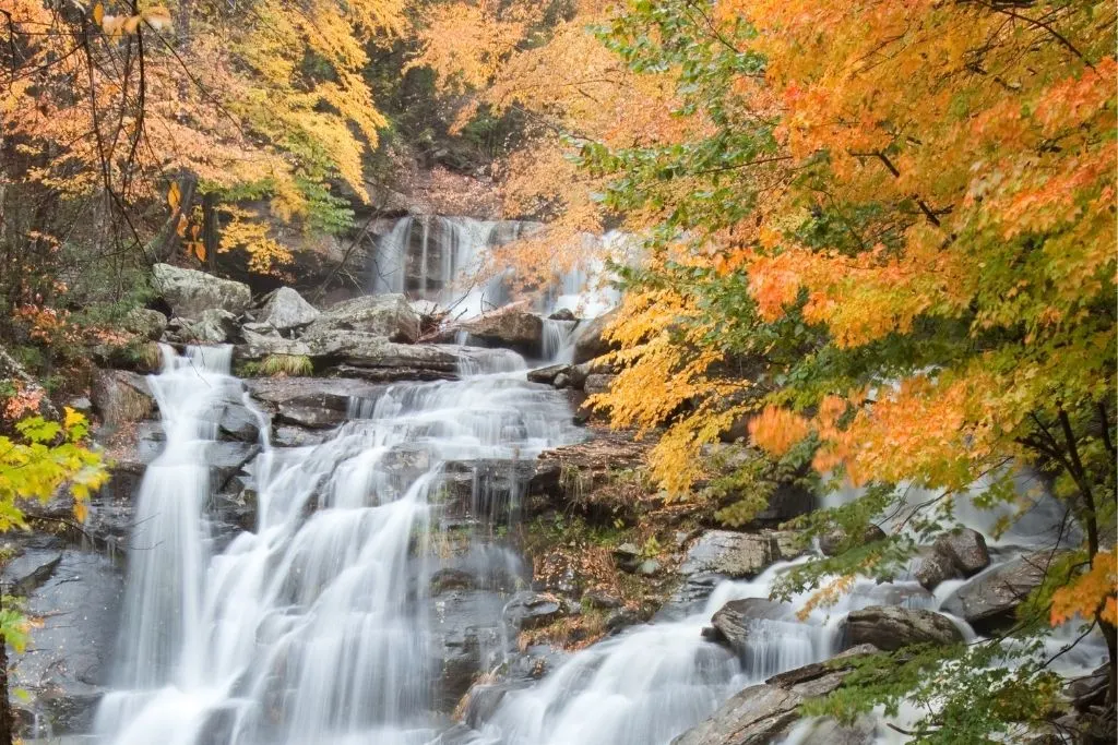 Bastion Falls surrounded by fall foliage in the Catskills region of New York.