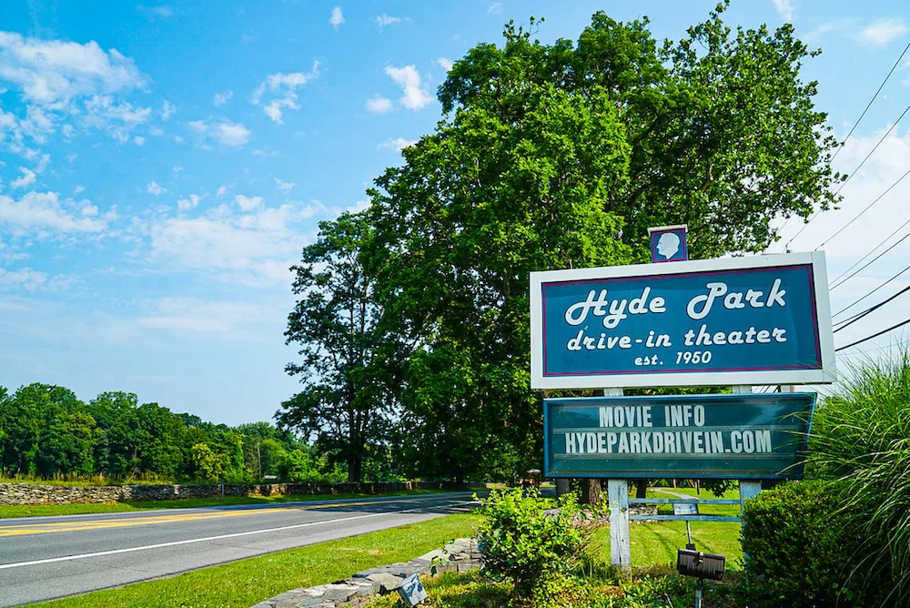 The sign in front of the Hyde Park Drive with a road passing through is one of the cool places to visit and things to do in Poughkeepsie NY