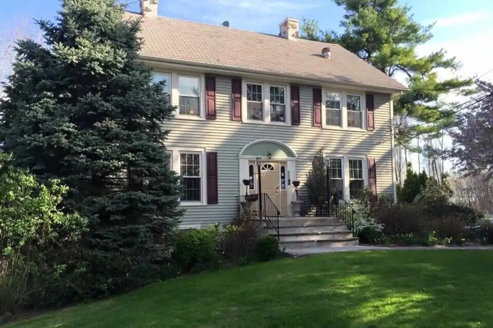 Beige exterior of the Alpine Haus Bed and breakfast Inn in New Jersey, one of the best ski resorts near NYC. 