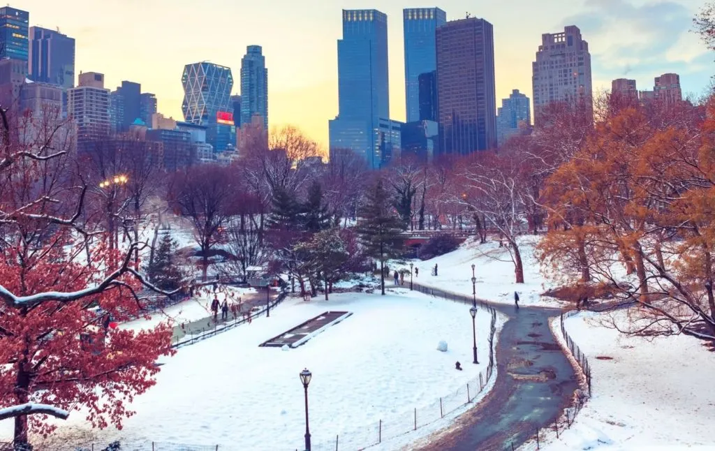 Snow on the ground during winter at sunset in Central Park. 