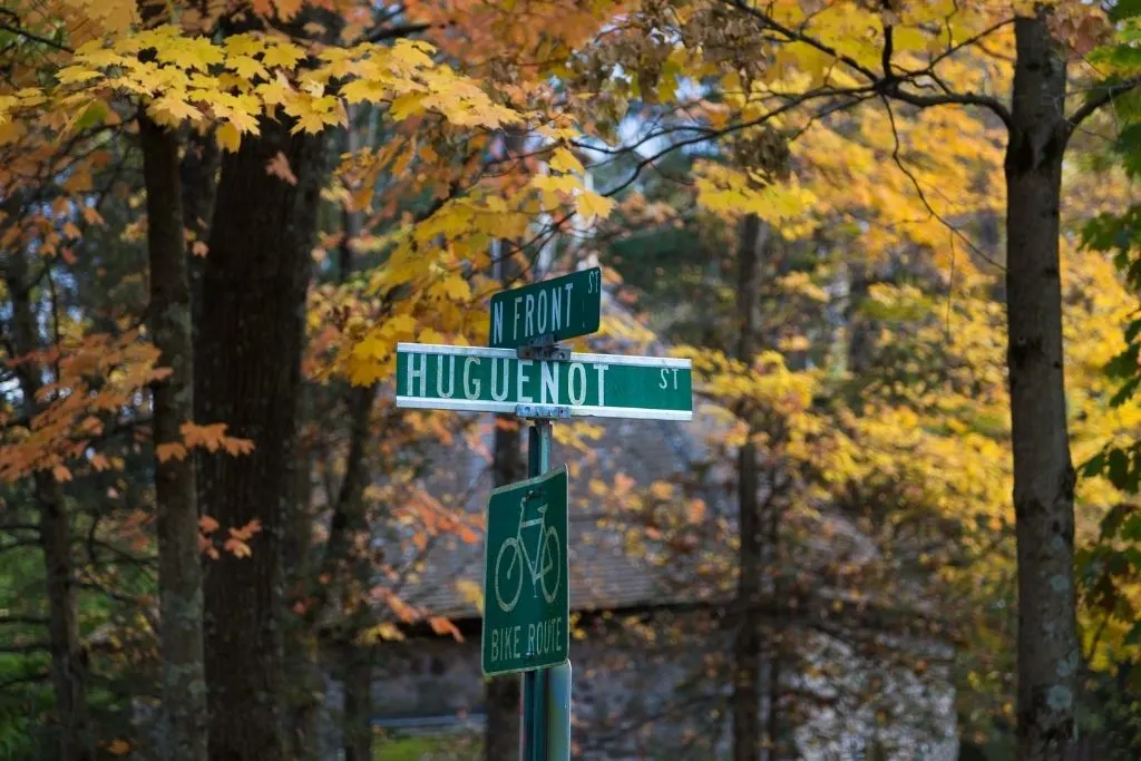 Green street sign for Huguenot Street in New Paltz, NY. 