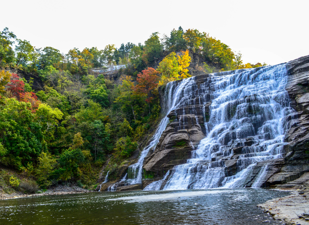 View of Lucifer Falls with the autumn foliage from one of the best hikes in the Finger Lakes. 