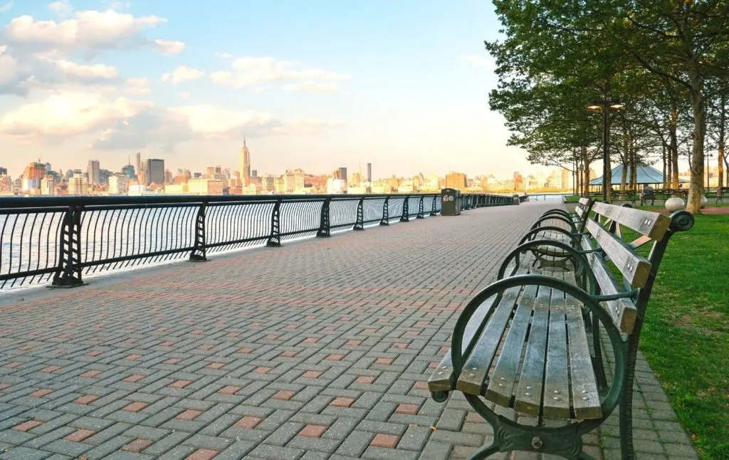 View of the Manhattan skyline from a park on the Hudson River. 