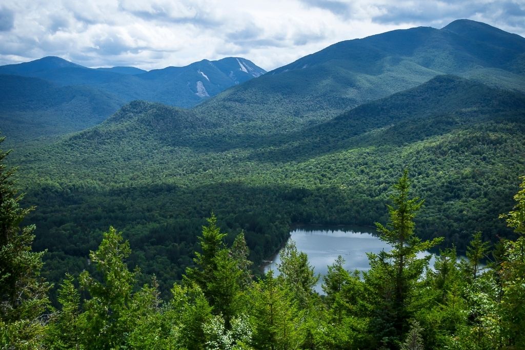 Panoramic view of the Adirondacks from a lookout on Mount Jo, one of the best things to do in Lake Placid, NY. 