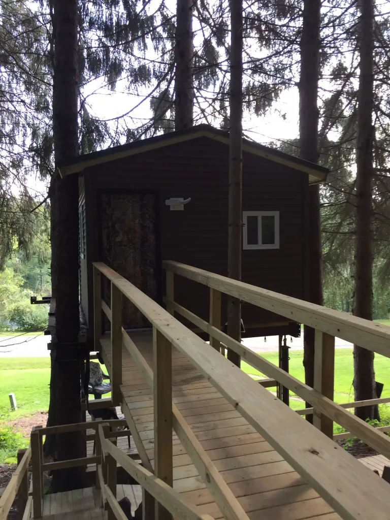 The wood-paneled exterior of one of the best treehouses in New York. 