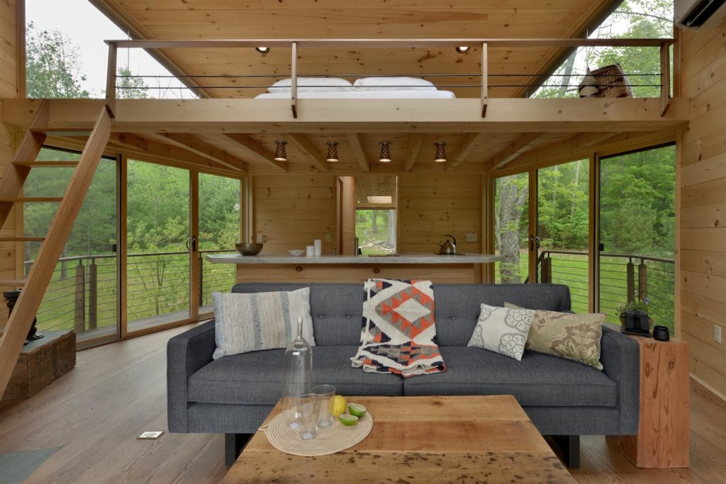 The loft and interior of the Willow Treehouse in the Catskils. One of the best treehouse rentals in NY. 