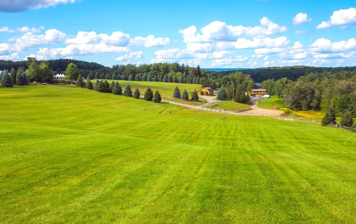 Farms and small houses in the green fields of Woodstock, NY. 