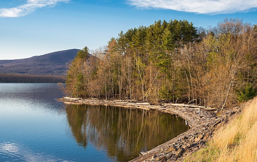 View of Ashokan Reservoir in the Catskills at sunset, one of the best things to do in Woodstock NY. 