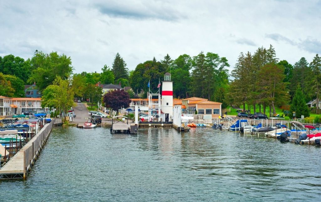 Lighouse and boats docked at the marina in Cooperstown NY. 