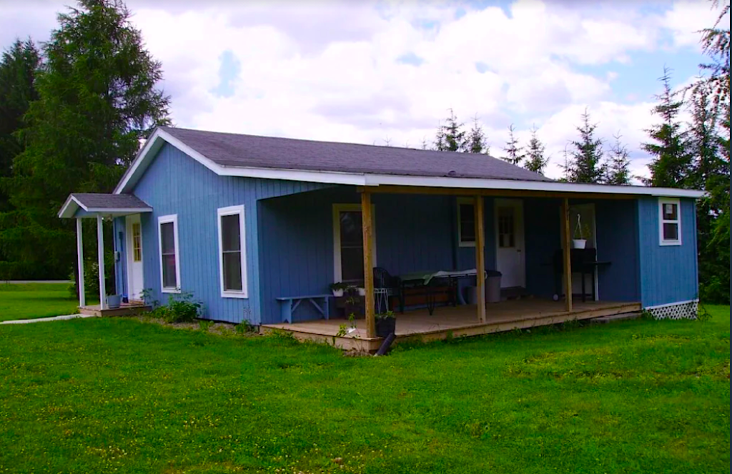 Cozy rustic blue cabin with beautiful views near Keuka Lake in the Finger Lakes. 