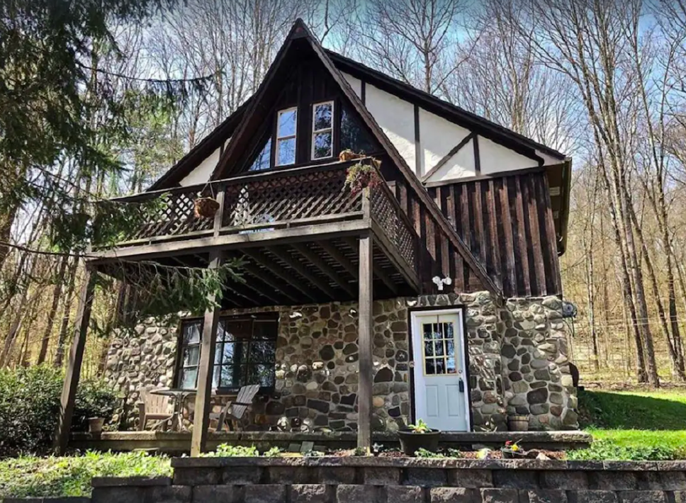 Wood and stone exterior of one of the best cabin getaways in New York near Binghamton. 