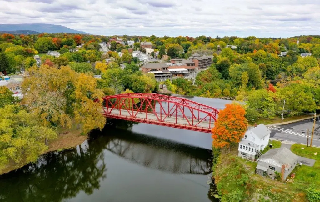 An aerial view of the Red bridge spanning Esopus Creek and the greenery surrounding it is one of the cool places to explore near Woodstock NY. 