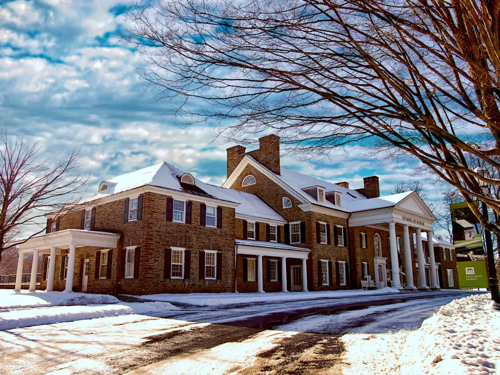 The exterior of the Fenimore Art Museum is covered in snow. One of the best things to do in Cooperstown NY.  
