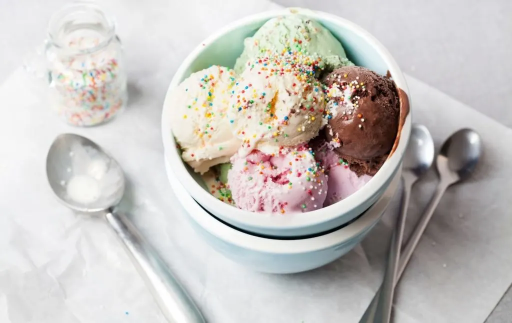 Four scoops of homemade ice cream in a bowl. 