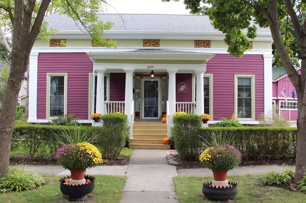 Vibrant pink exterior of the Blackberry Inn Bed and Breakfast. 