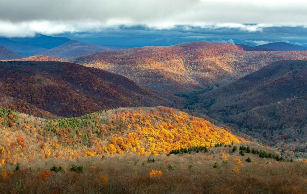 Catskills Mountains in the fall with vibrant fall foliage. 