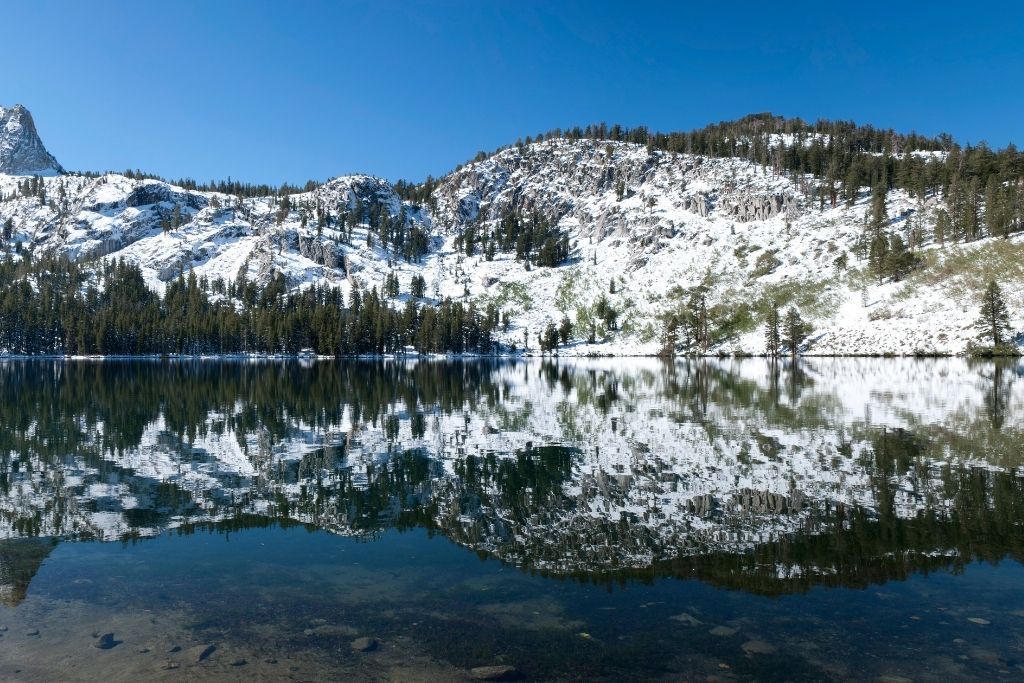 Snow covering the mountains around Lake George. 