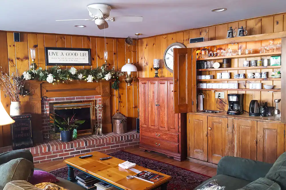 Wood-paneled communal living room in the Whitehouse Inn. 