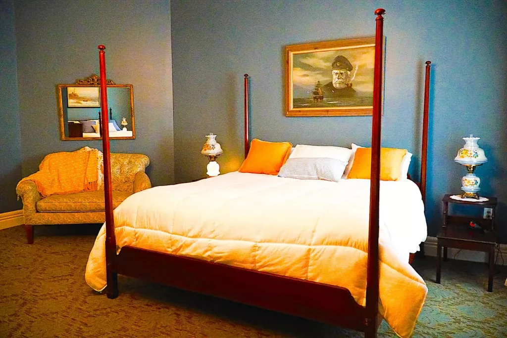 Posh room inside the Broadalbin Hotel with a luxurious 4 poster bed  in Saratoga Springs, NY. 