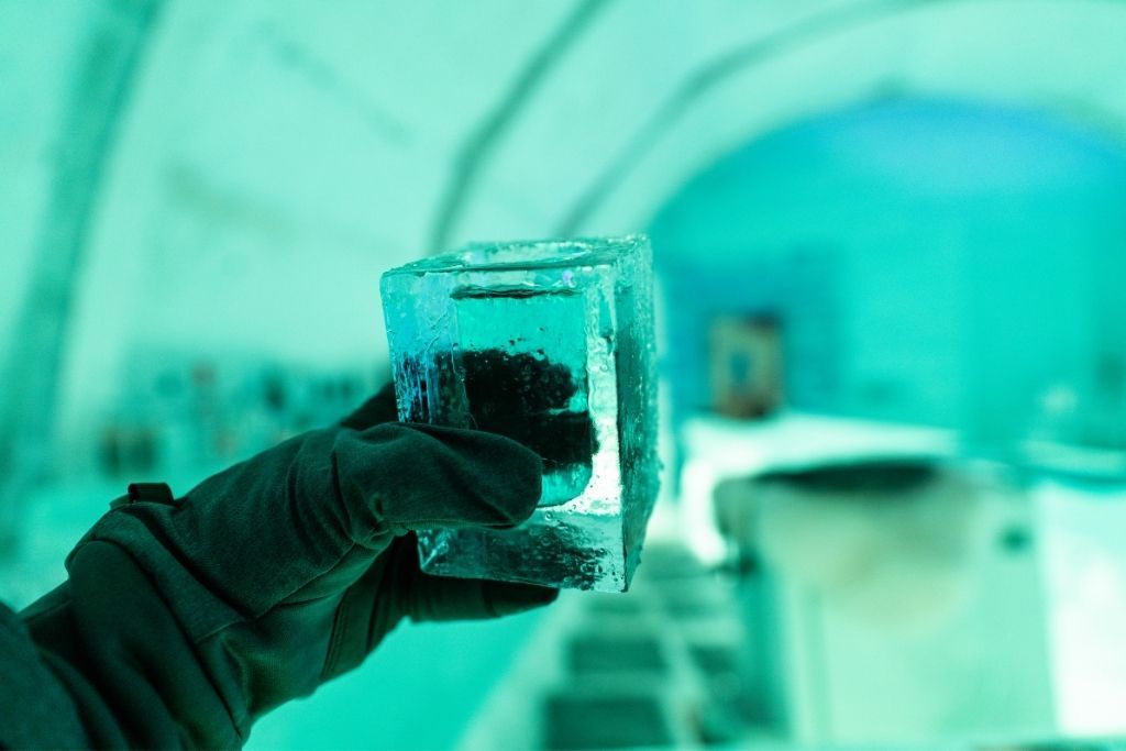 Glass made of ice inside an ice bar, one of the best things to do in Lake George in winter.