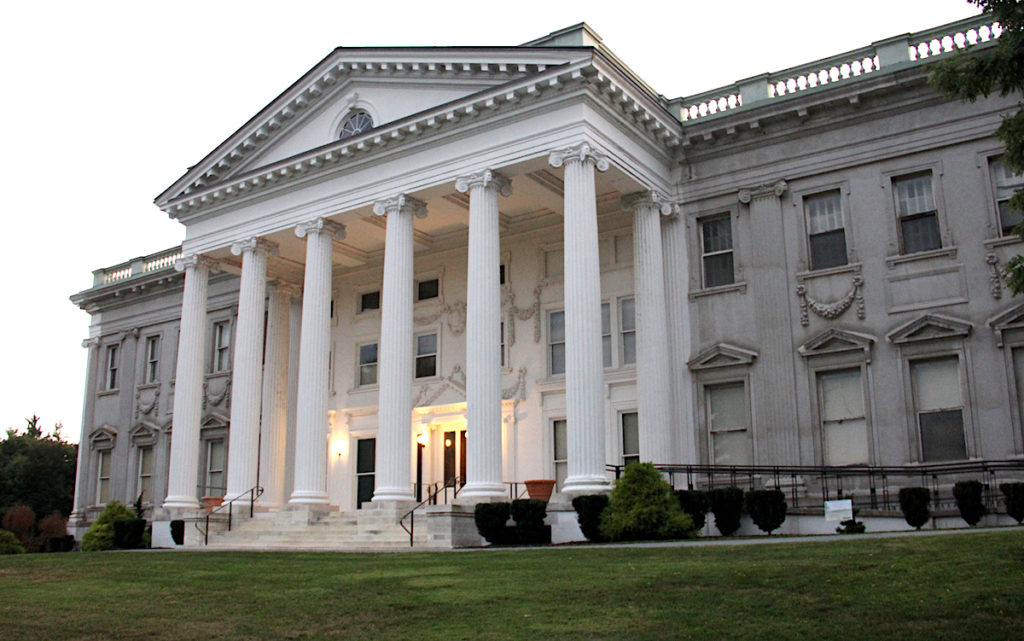 The impressive white exterior of the Beaux-Arts style Mills-Livingston Mansion in the Mills Mansion at Straatsburgh State Historic Site. 