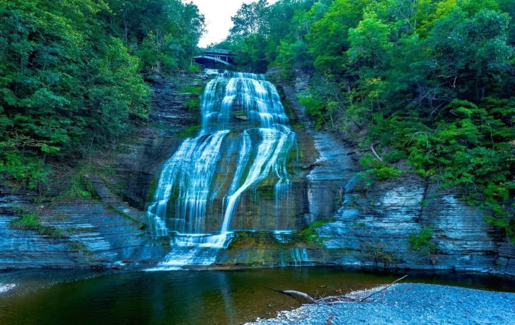 View of Shequaga Falls and the calm lake at the botttom in Montour Falls is a part of one of the popular hikes in the Finger Lakes. 