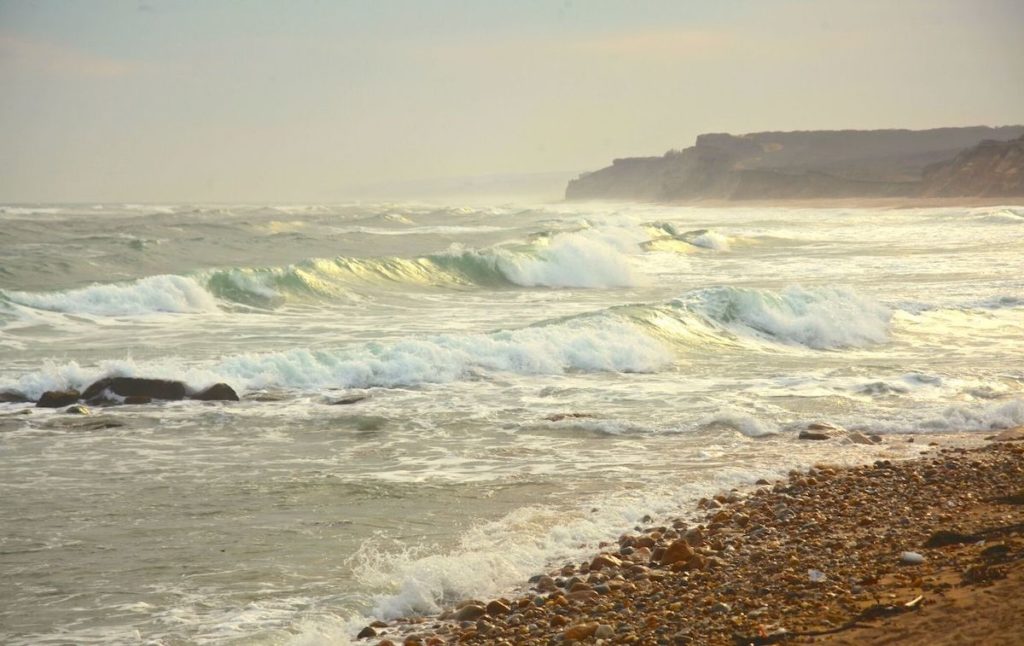 Waves crashing onto the shore at Ditch Plains Beach in Montauk, one of the best Hamptons beaches of them all. 