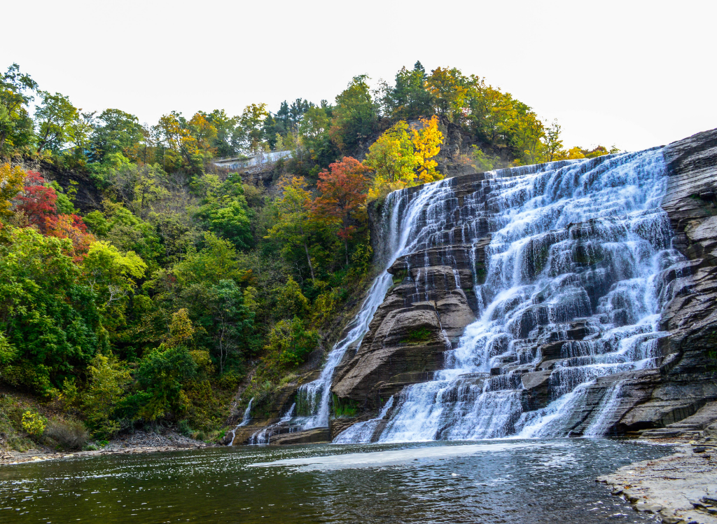View of Lucifer Falls with the autumn foliage and the pool at its base. One of the best waterfalls in New York.