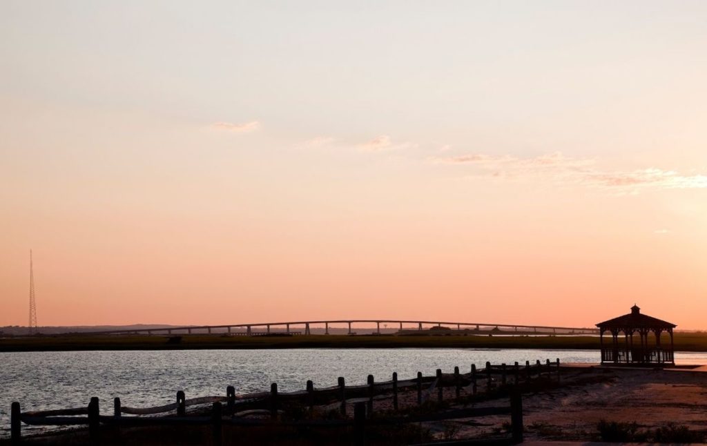 Looking out at the bridge and pavilion at sunrise from Ponquogue Beach.