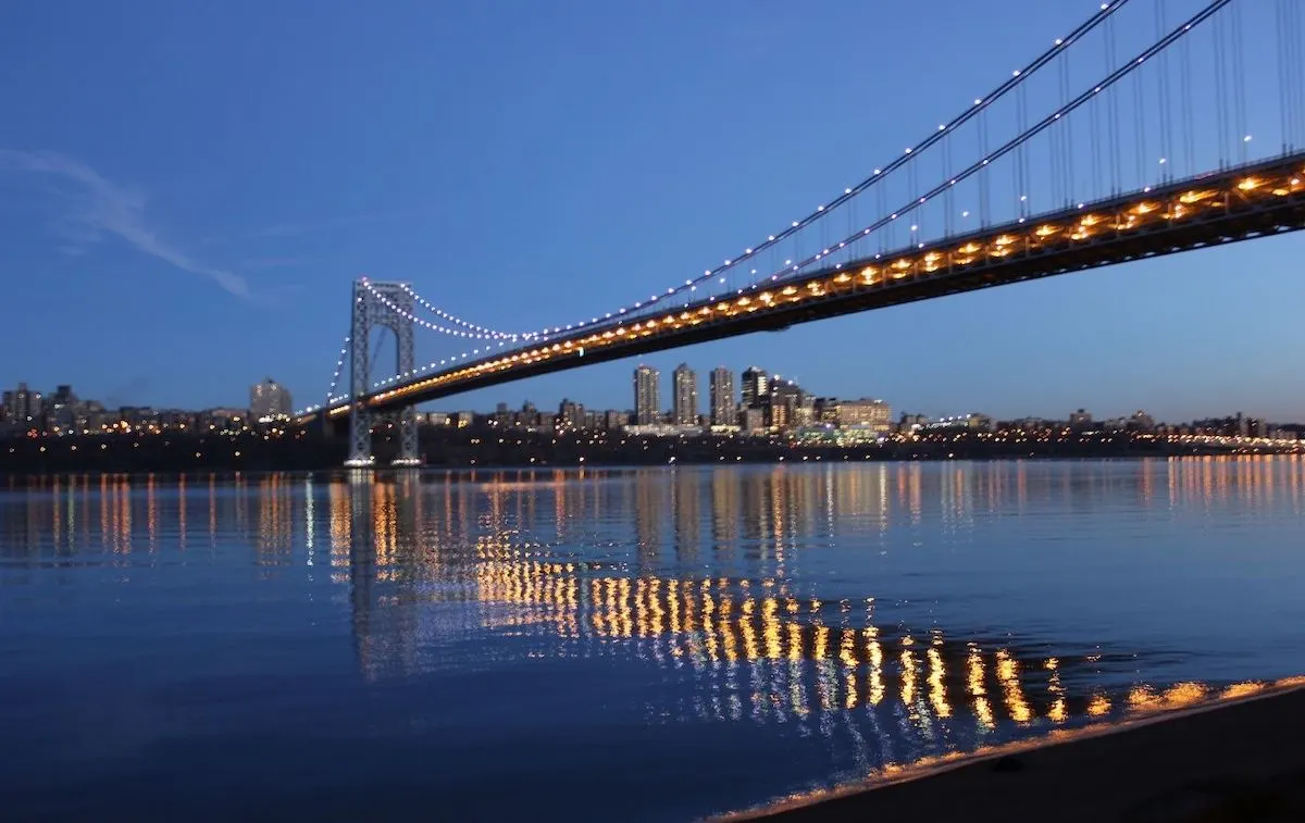 View of the George Washington Bridge in the evening from New Jersey and one of the best hikes near NYC. 