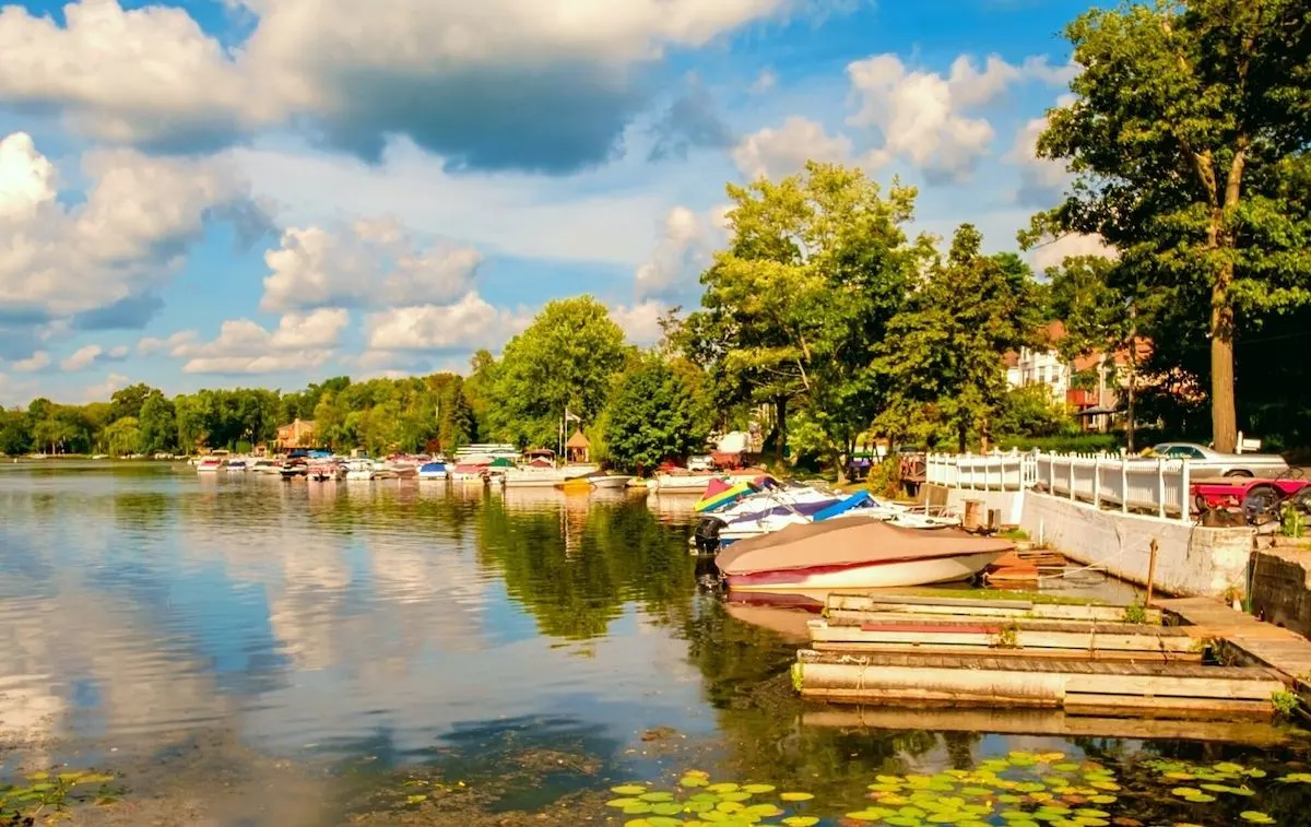 Boats lined up at the shore of Greenwood Lake, one of the best lakes near NYC