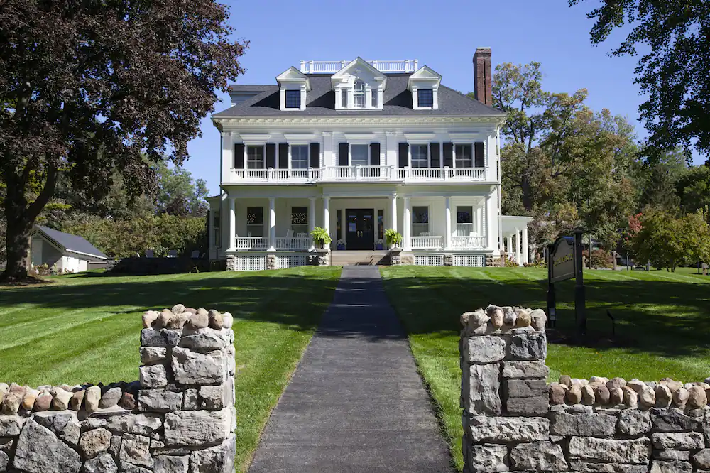 White, federal-style building of the Inns at Aurora, one of the most romantic getaways in the Finger Lakes, NY. 