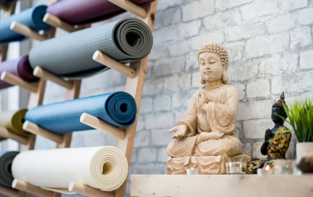 Statue of a Buddha in a yoga studio at one of the best yoga retreats in New York. 