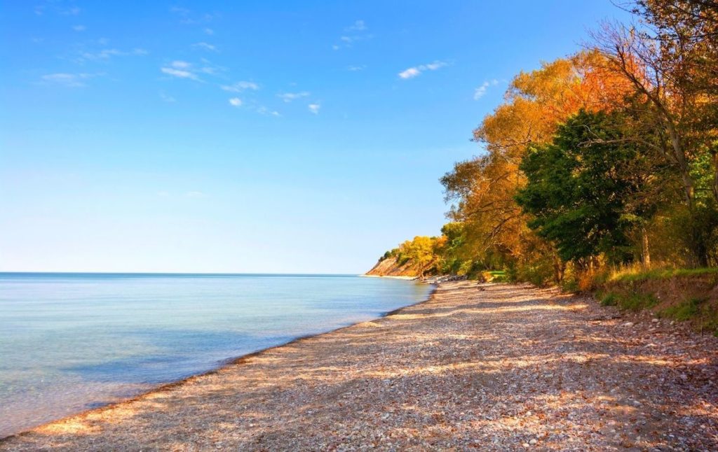 View of the lake and fall foliage at Chimney Bluffs State Park. One of the best state parks in New York. 