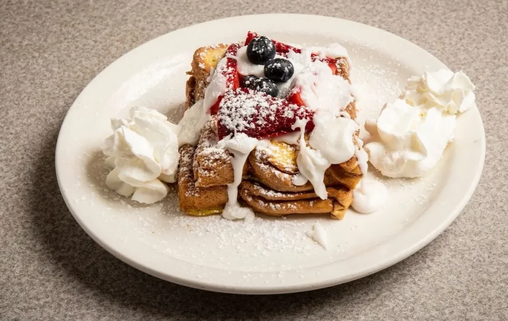 French Toast with whipped cream and berries from one of the best diners in brooklyn. 