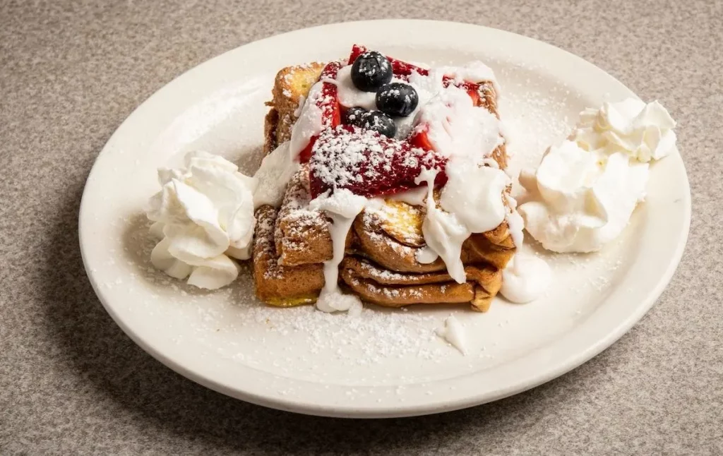 Decadent French Toast from Ellen's Stardust Diner from one of the quirky restaurants in NYC at Ellen's Stardust Diner. 