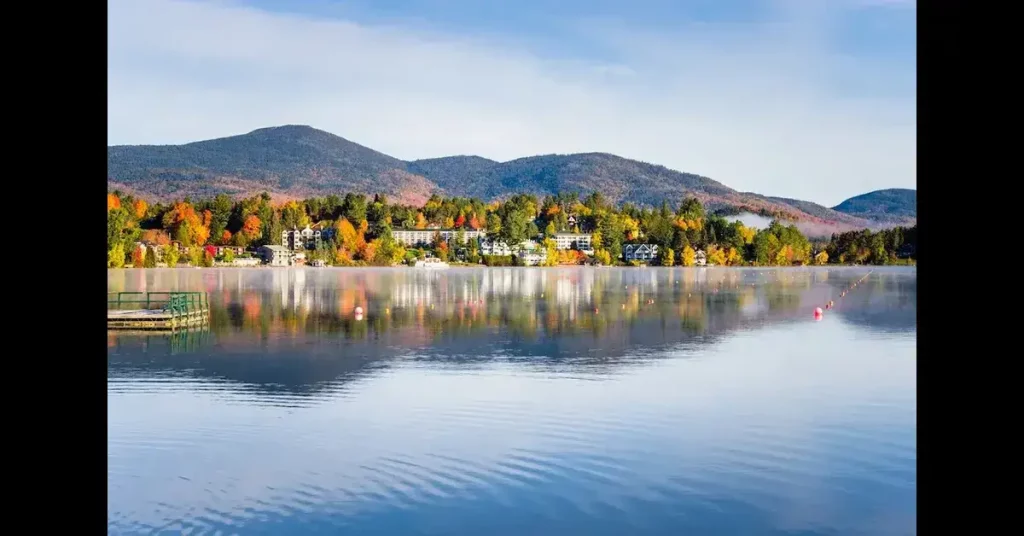 Exterior View of the Mountain Village of Lake Placid from a Foggy Mirror Lake at Sunrise