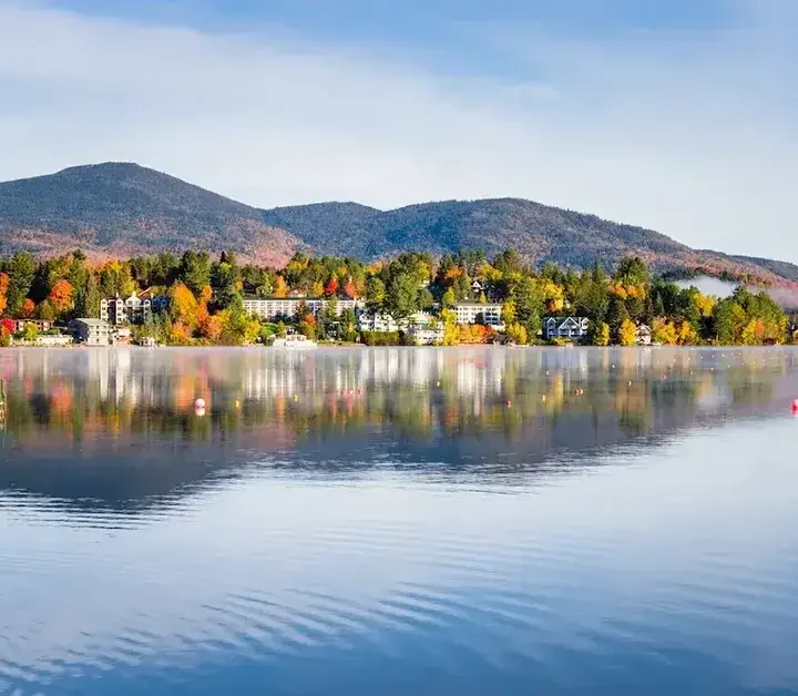 Exterior View of the Mountain Village of Lake Placid from a Foggy Mirror Lake at Sunrise