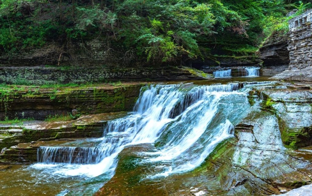 View of a waterfall along the gorge trail ay Robert H. Treman State Park, one of the top state parks in New York