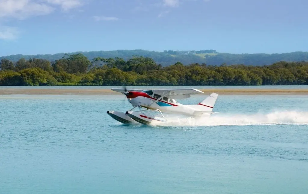 seaplane landing in the water in the Hamptons.