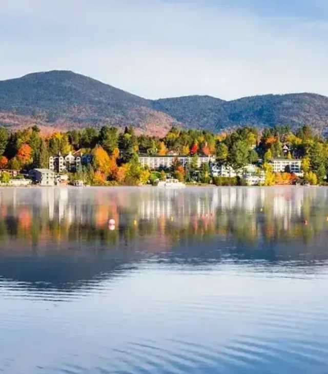 Exterior View of the Mountain Village of Lake Placid from a Foggy Mirror Lake at Sunrise