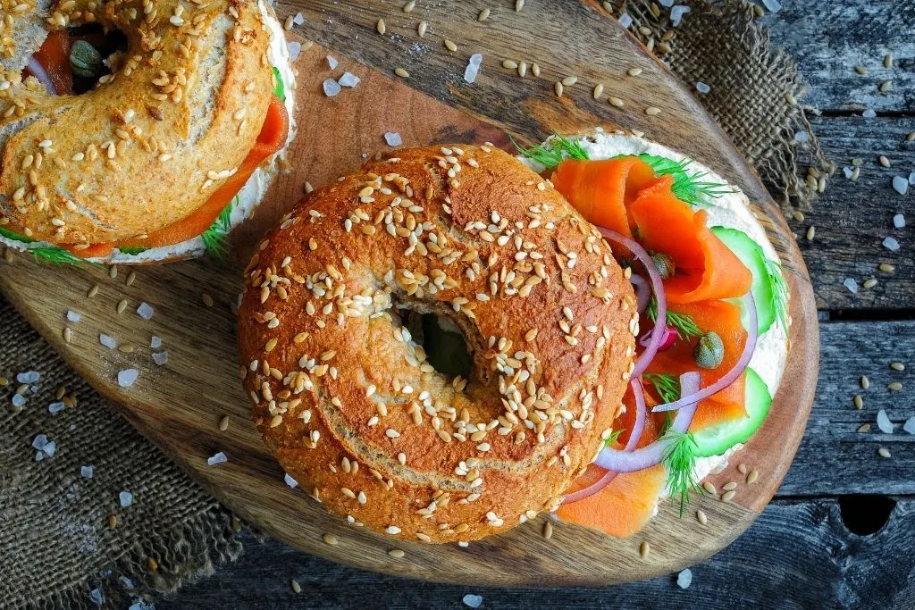 Aerial view of a bagel with lox and creamcheese. 
