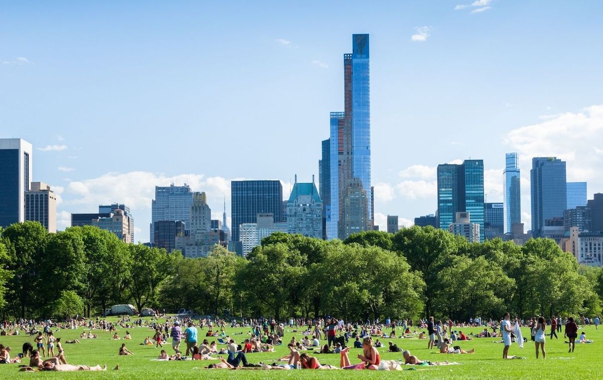 People hanging out on Sheep's Meadow in Central Park.