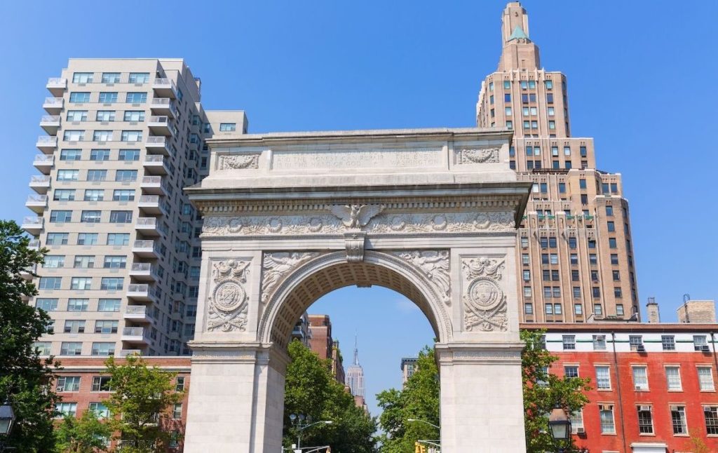 View of Marble Arch in Washington Square Park with the Empire State Building in the background. 