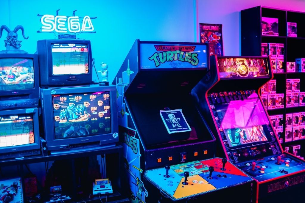 Vintage arcade games lit up in neon lights in a bar in NYC is a great way to spend your birthday if you enjoy the nostalgia.