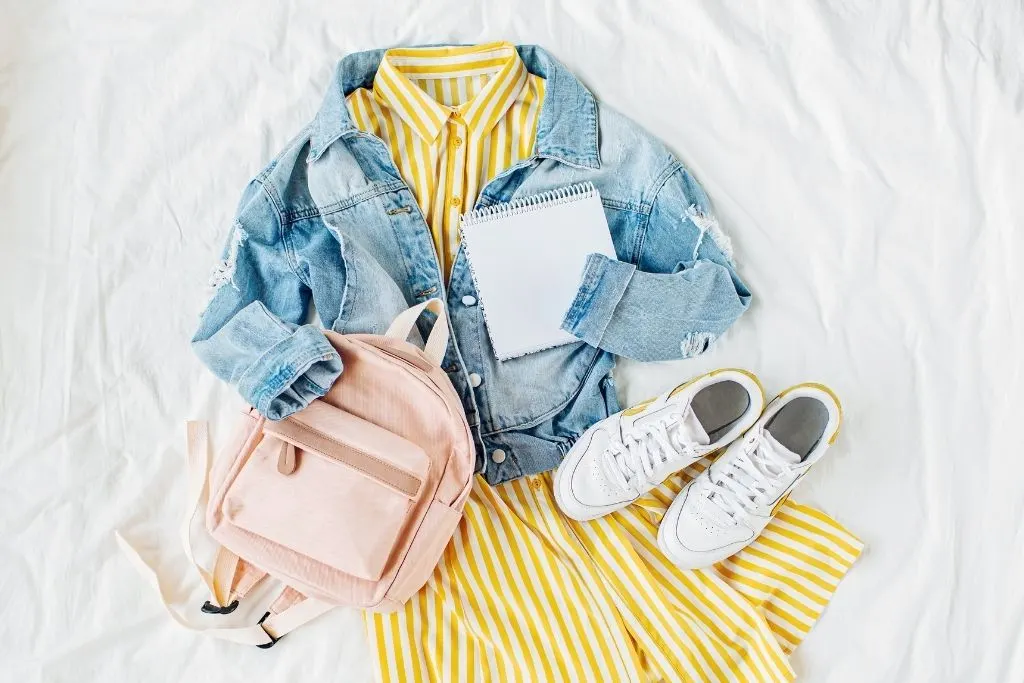 Vintage dress with yellow stripes and a jean jacket from one of the spots for the best shopping in NYC. 