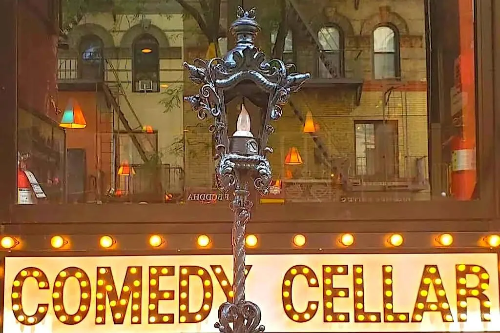 View of the comedy cellar sign and one of the best things to do in NYC after midnight. 
