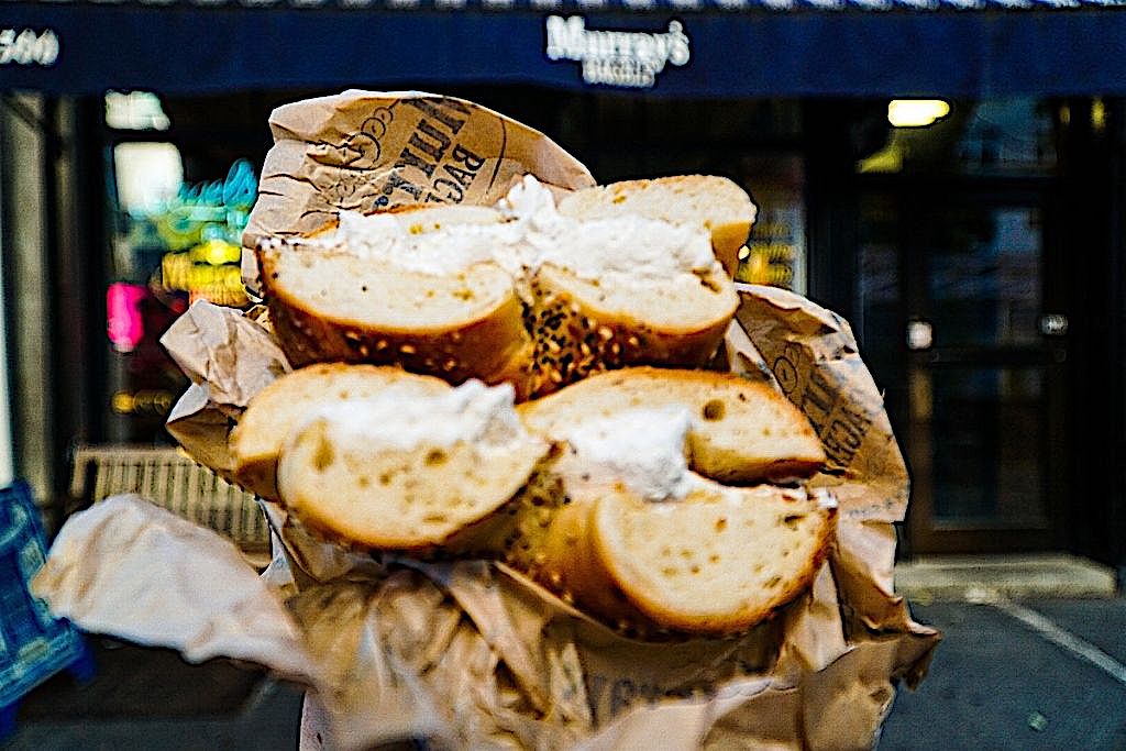 Bagel with cream cheese from Murray's bagel during a food tour. Tasting these is definitely one of the coolest birthday treats in NYC.