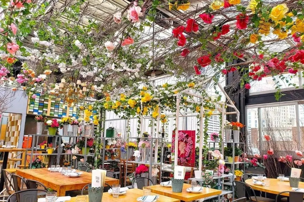 Over the top floral-inspired decor at Serre by Birreria, one of the best birthday ideas NYC has to offer. 