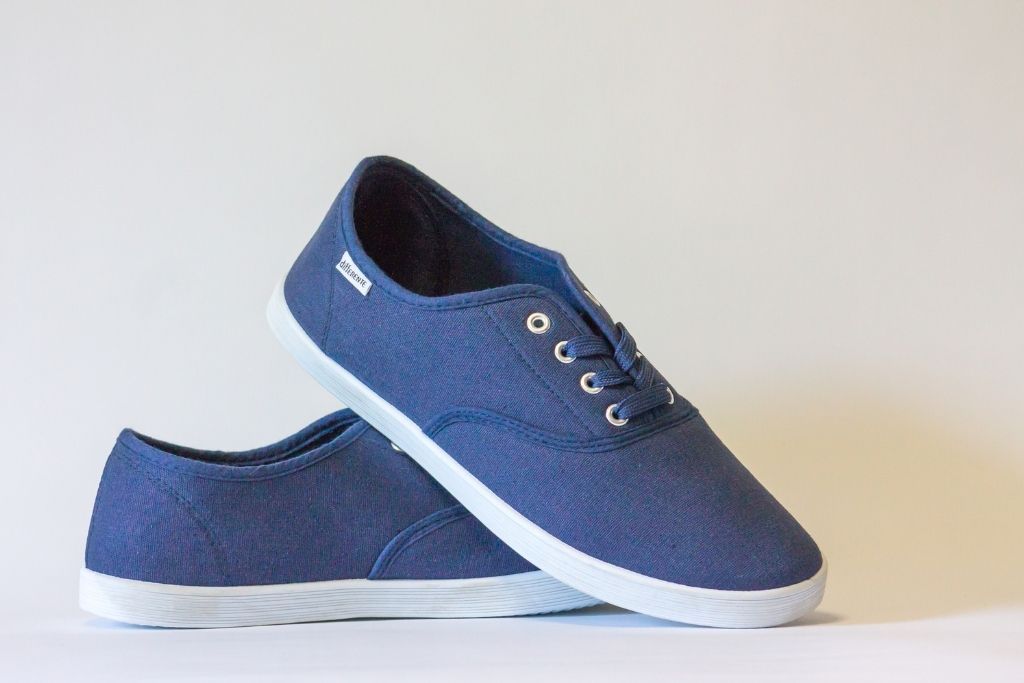 Pair of navy blue, slip-on shoes from one of the best places to shop on a budget in  NYC. 